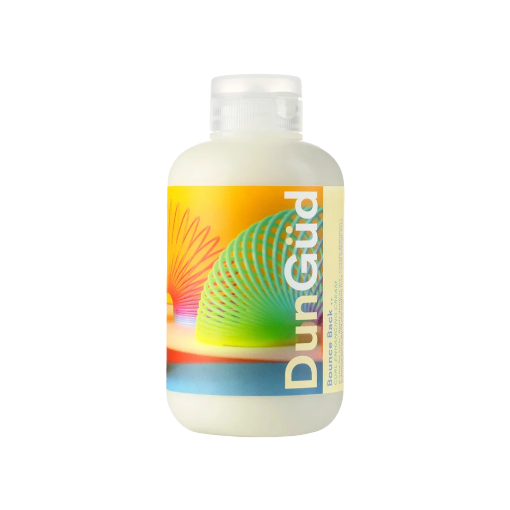 Fles DunGüd Bounce Back Curl Enhancing Cream met kleurrijk etiket en speelse slinky-illustratie.