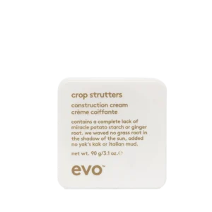 Vierkante witte verpakking van evo crop strutters construction cream van 90 gram met goudkleurige tekst.