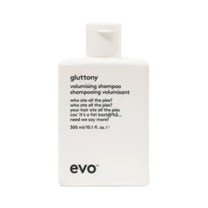 Witte fles Evo Gluttony Volumising Shampoo van 300 ml met zwarte tekst en humoristische beschrijving op het etiket.
