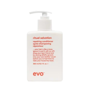 Witte fles evo Ritual Salvation repairing conditioner van 300 ml met rode tekst en pompdispenser.