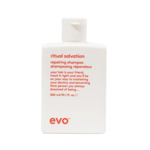 Witte flacon van Evo Ritual Salvation Repairing Shampoo van 300 ml met rode tekst op de voorkant.