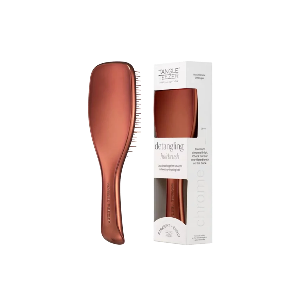 Bronzen Tangle Teezer ontklittingsborstel naast de bijbehorende verpakking.
