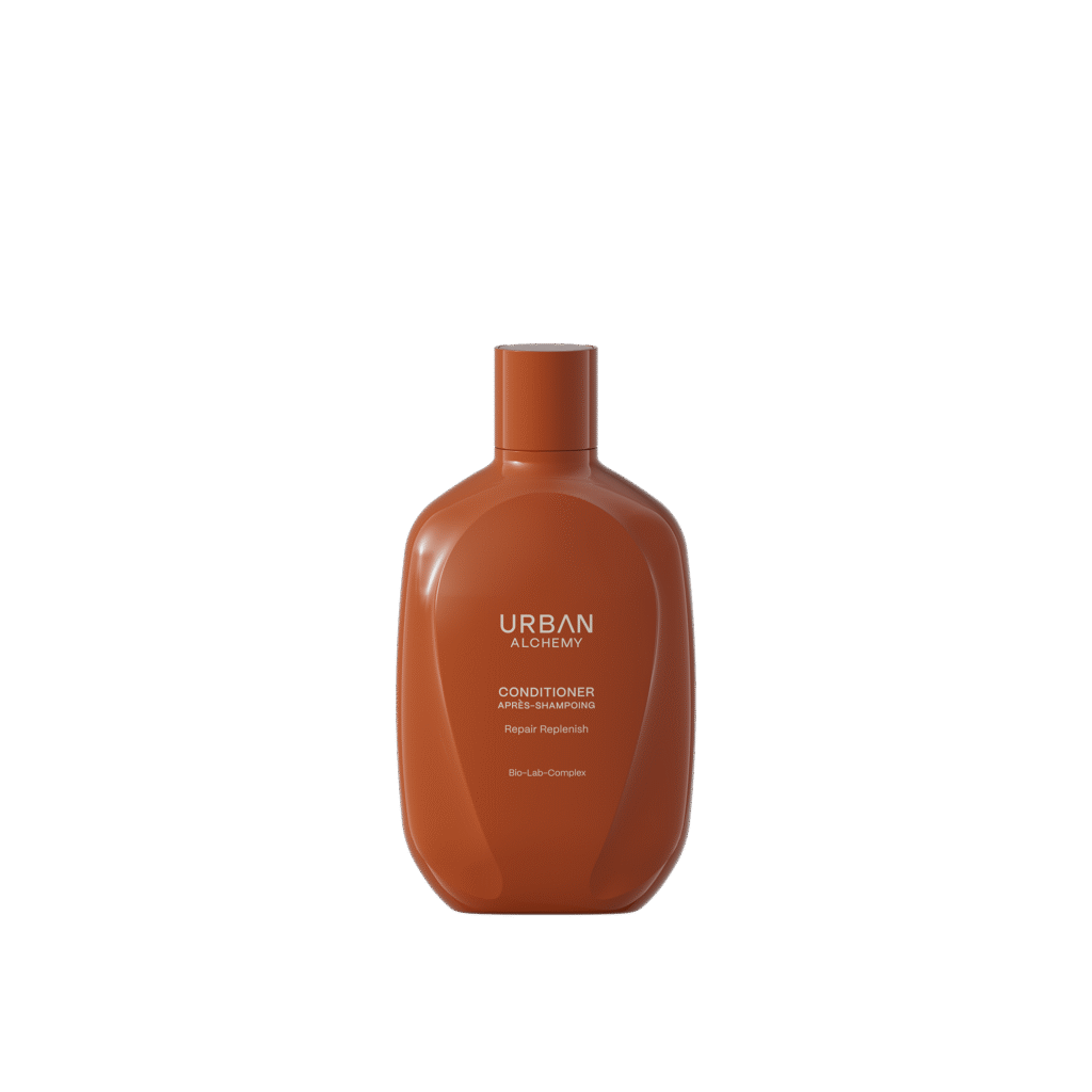 Bruine fles Urban Alchemy Conditioner Repair Replenish met Bio-Lab-Complex op zwarte achtergrond.