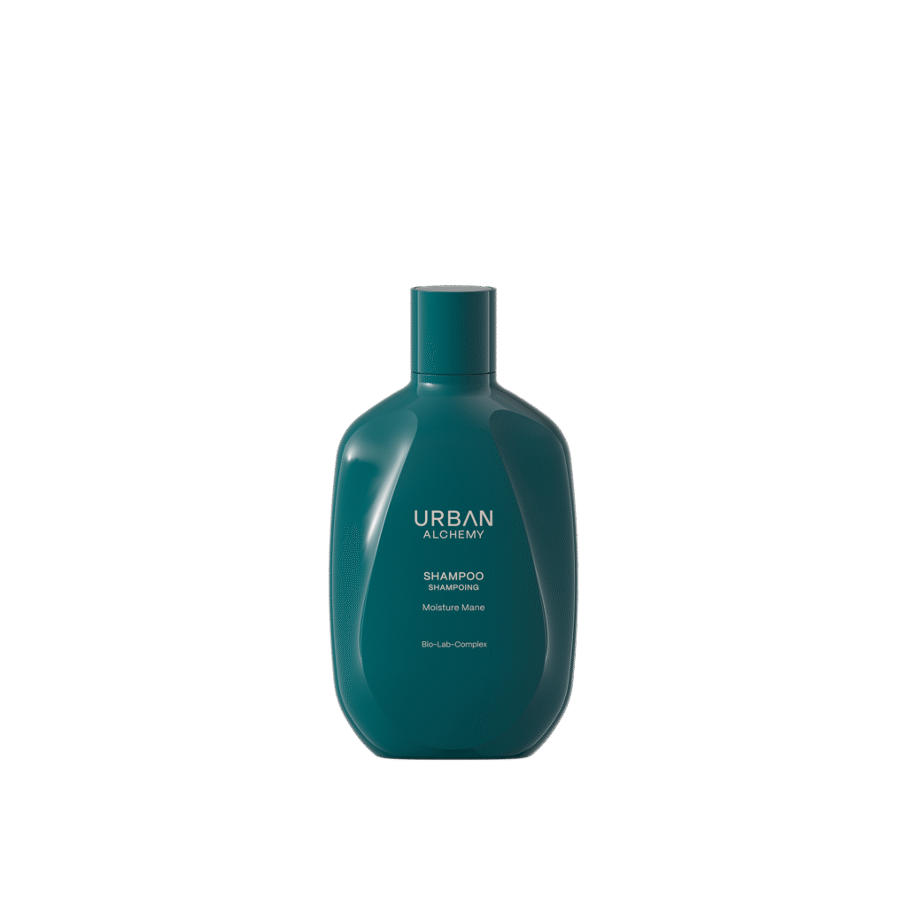Donkergroene fles Urban Alchemy Moisture Mane shampoo met witte opdruk op een zwarte achtergrond.